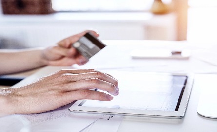 Person paying bill on computer